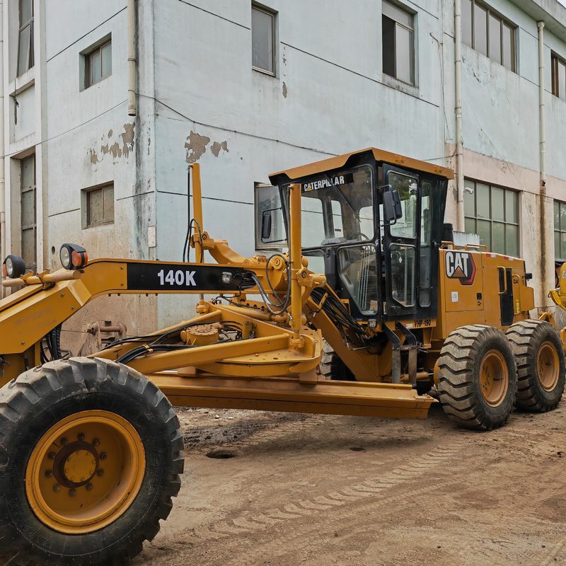 Używany grabiarz, wyrównywacz gruntów, Caterpillar CAT140K, maszynka drogowa, używany japoński ciągnik, silnik w dobrym stanie.
