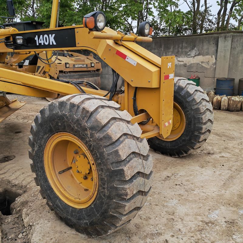 Używany grabiarz, wyrównywacz gruntów, Caterpillar CAT140K, maszynka drogowa, używany japoński ciągnik, silnik w dobrym stanie.