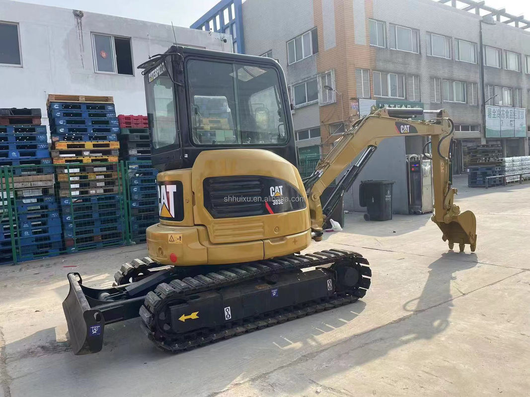 mini używany bagator żółtego koloru cat303e na sprzedaż